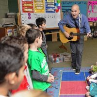 Geoffrey Gould teaches a first grade music class at Swift River Elementary School in Belchertown where in Feb he has started a Piano Lab where every student will learn piano.